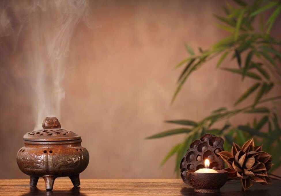 Incense burner and aromatic candle on table, Zen concept.